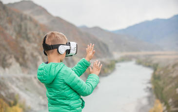 Little boy in virtual reality glasses