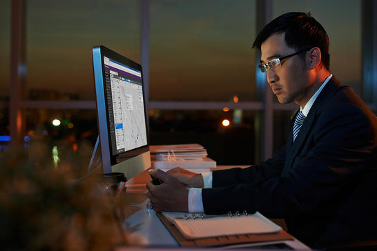 Man working in the office at night, with TEMS Cloud