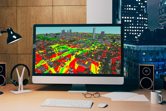 Monitor in office with 3D vegetation and buildings