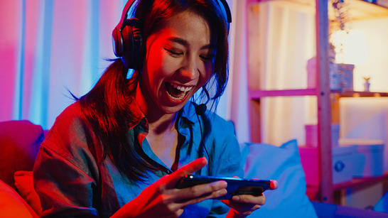 Woman playing a game on her phone